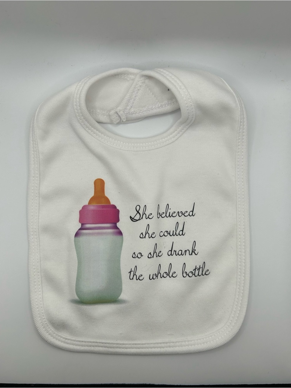 NWOT Cute White Baby Bib with Bottle Graphic and Quote